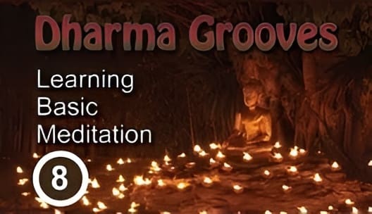 Meditation lesson with candles and statue.