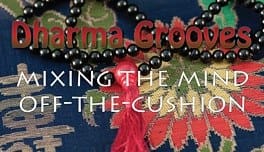 Dharma Grooves text with beads and fabric.