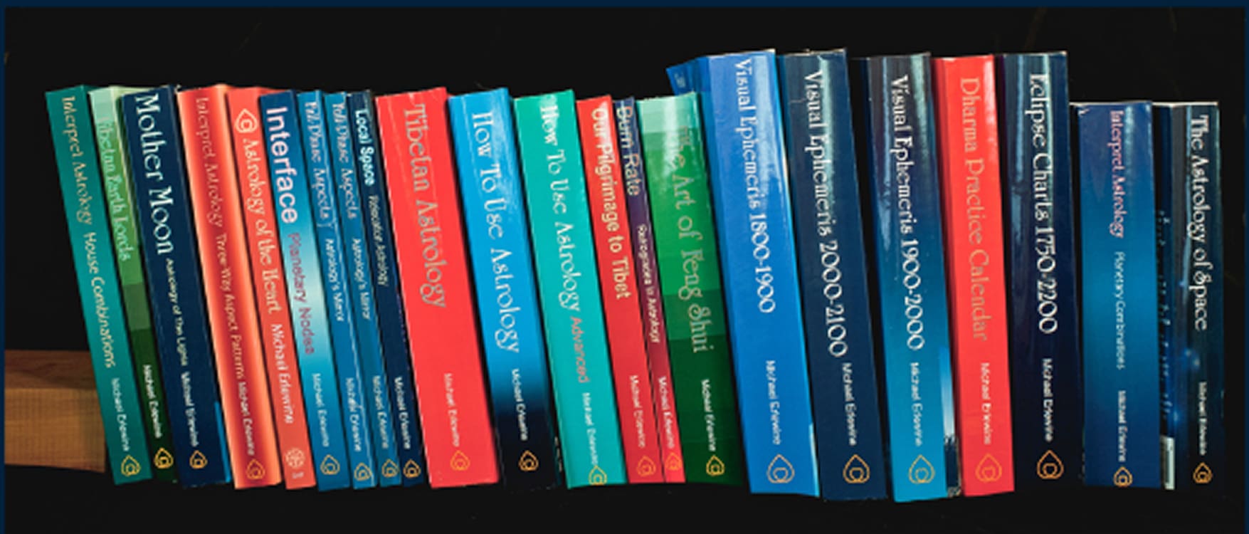 A row of books on statistics and data analysis topics lined up vertically.