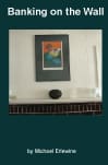 Framed artwork above speaker and small shelf