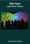 Silhouetted audience watching colorful psychedelic light show