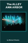 Book cover: concert stage with blue-green lights